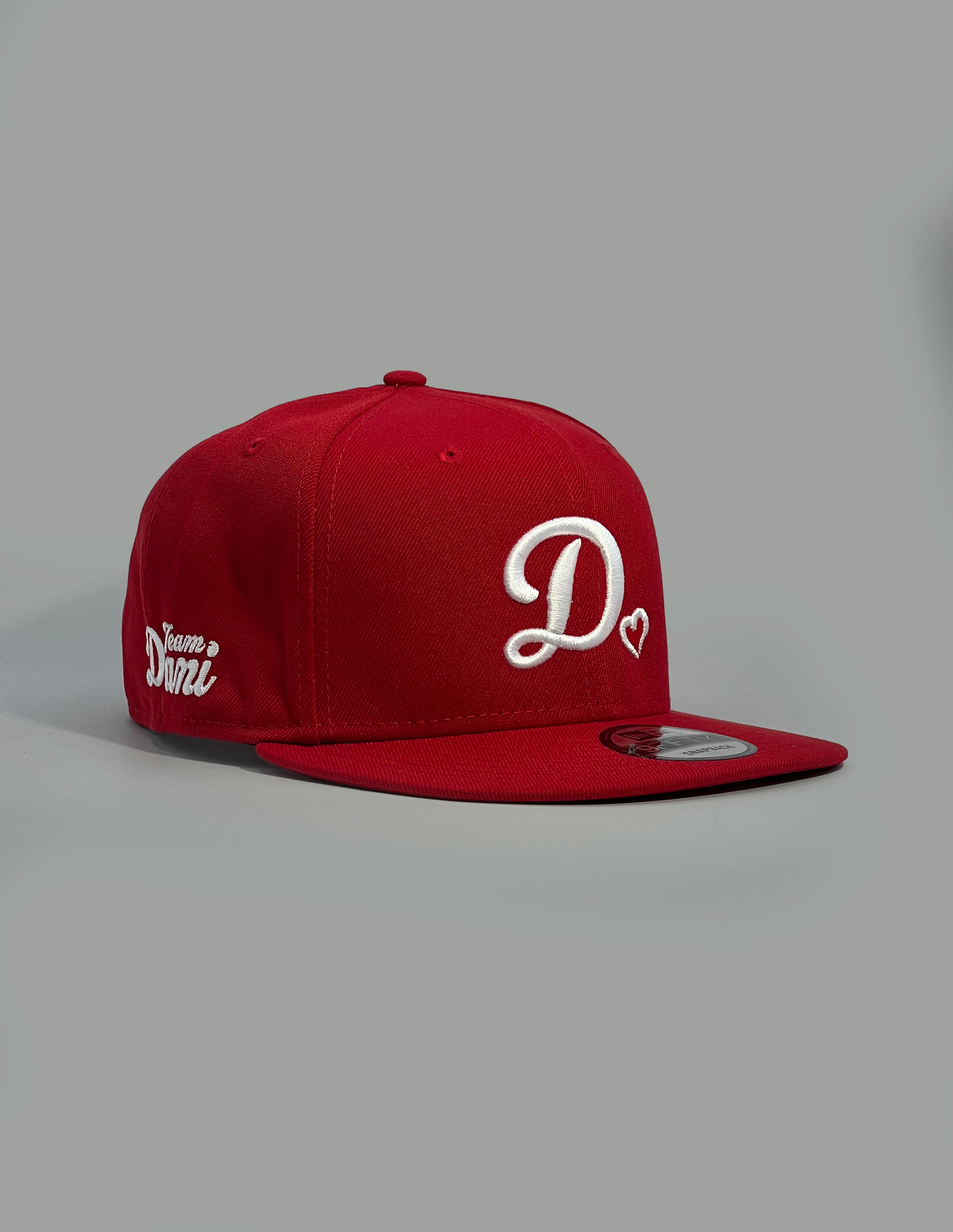Red cap with white D❤️logo on a gray background